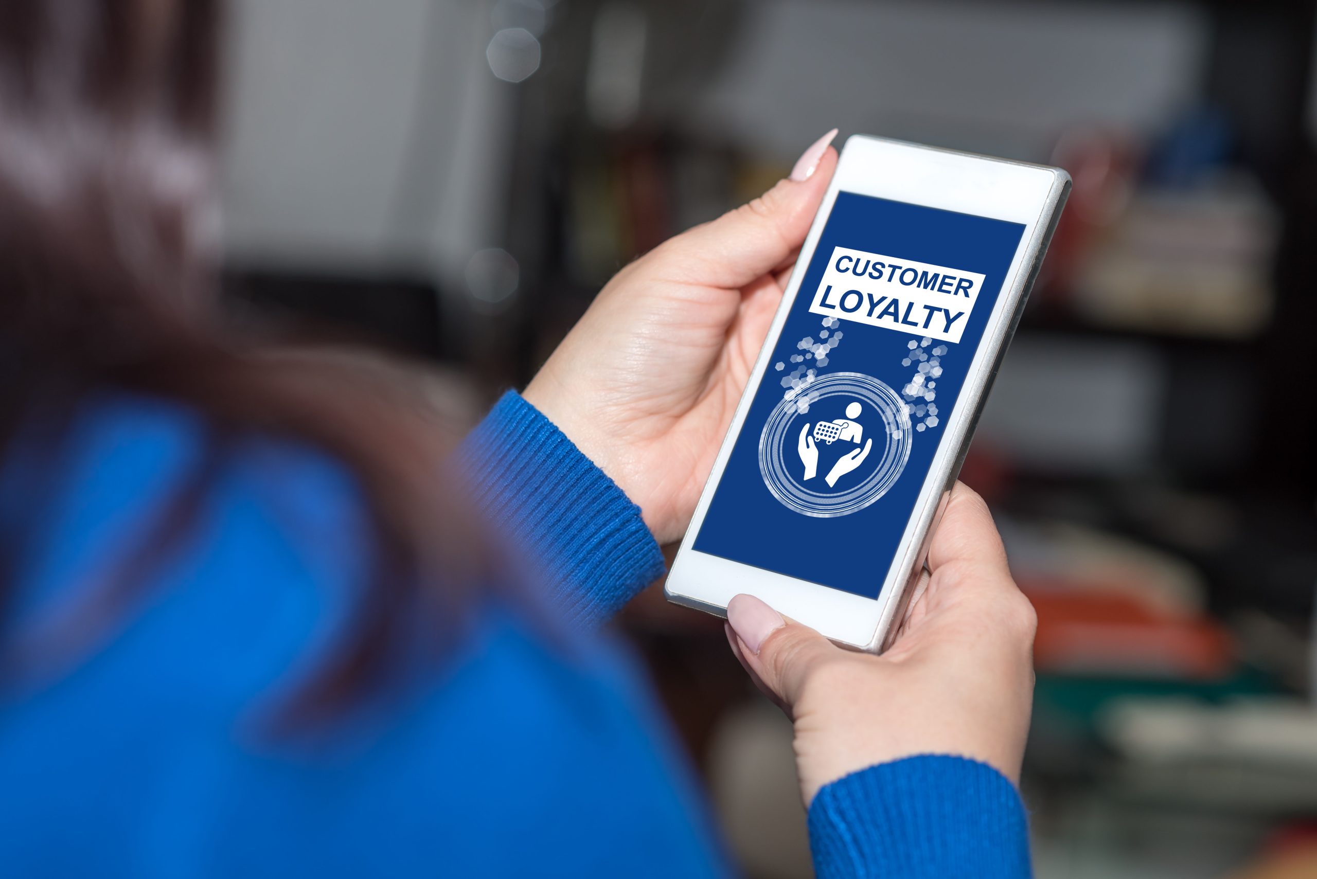 Customer using NX Restaurant loyalty and rewards on a smartphone